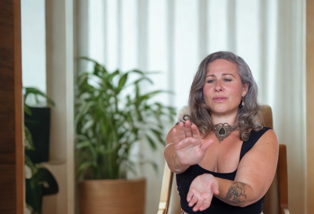 Jaime Verk Somatic Energy Healing practitioner in session with a client.